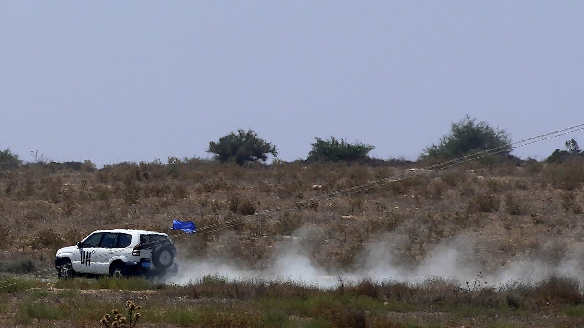 A United Nations vehicle passes inside the U.N. buffer zone at the village of Pyla in the Larnaca district of the divided island of Cyprus, Aug. 21, 2023. (AP Photo)