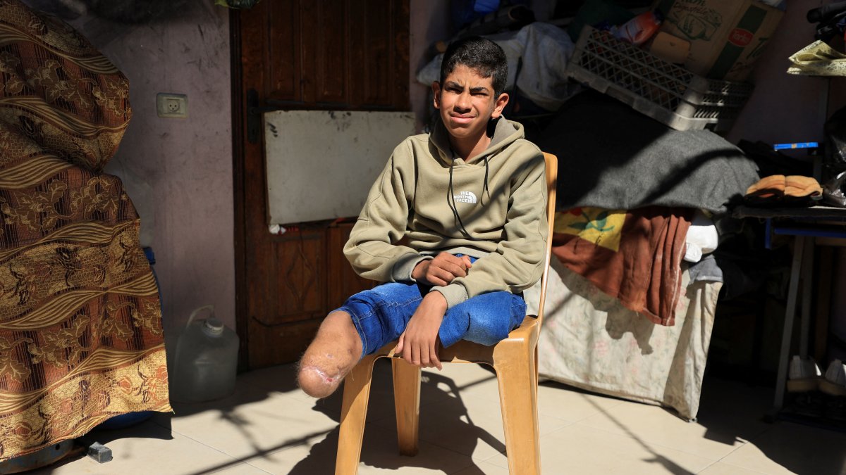 Fadel Al-Naji, 14, who lost both legs after being injured in an Israeli strike, sits at his home in Gaza City, April 10, 2026. (Reuters Photo)