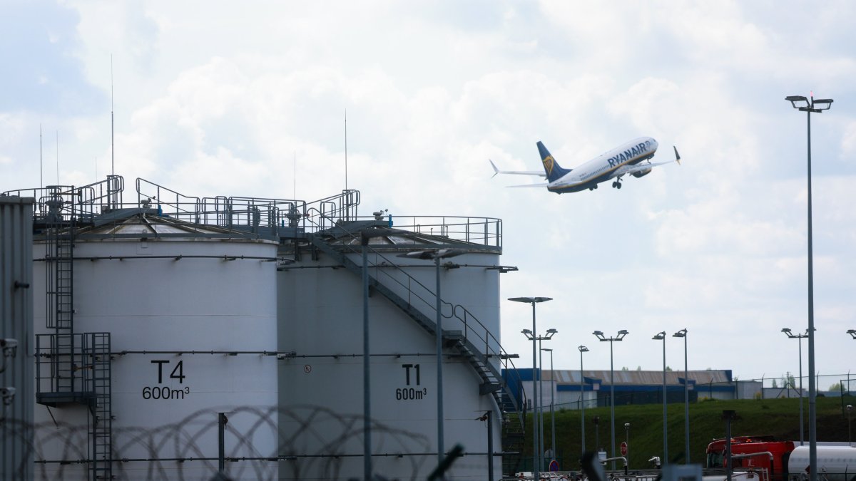 Kerosene storage facilities are seen as a Ryanair aircraft takes off from Brussels South Charleroi Airport, Charleroi, Belgium, April 16, 2026. (EPA Photo)
