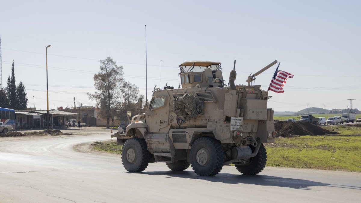 A U.S. military mine-resistant ambush protected (MRAP) armored fighting vehicle drives along a highway outside Qamishli in Syria's northeastern Hassakeh province, Feb. 22, 2026. (AFP File Photo)
