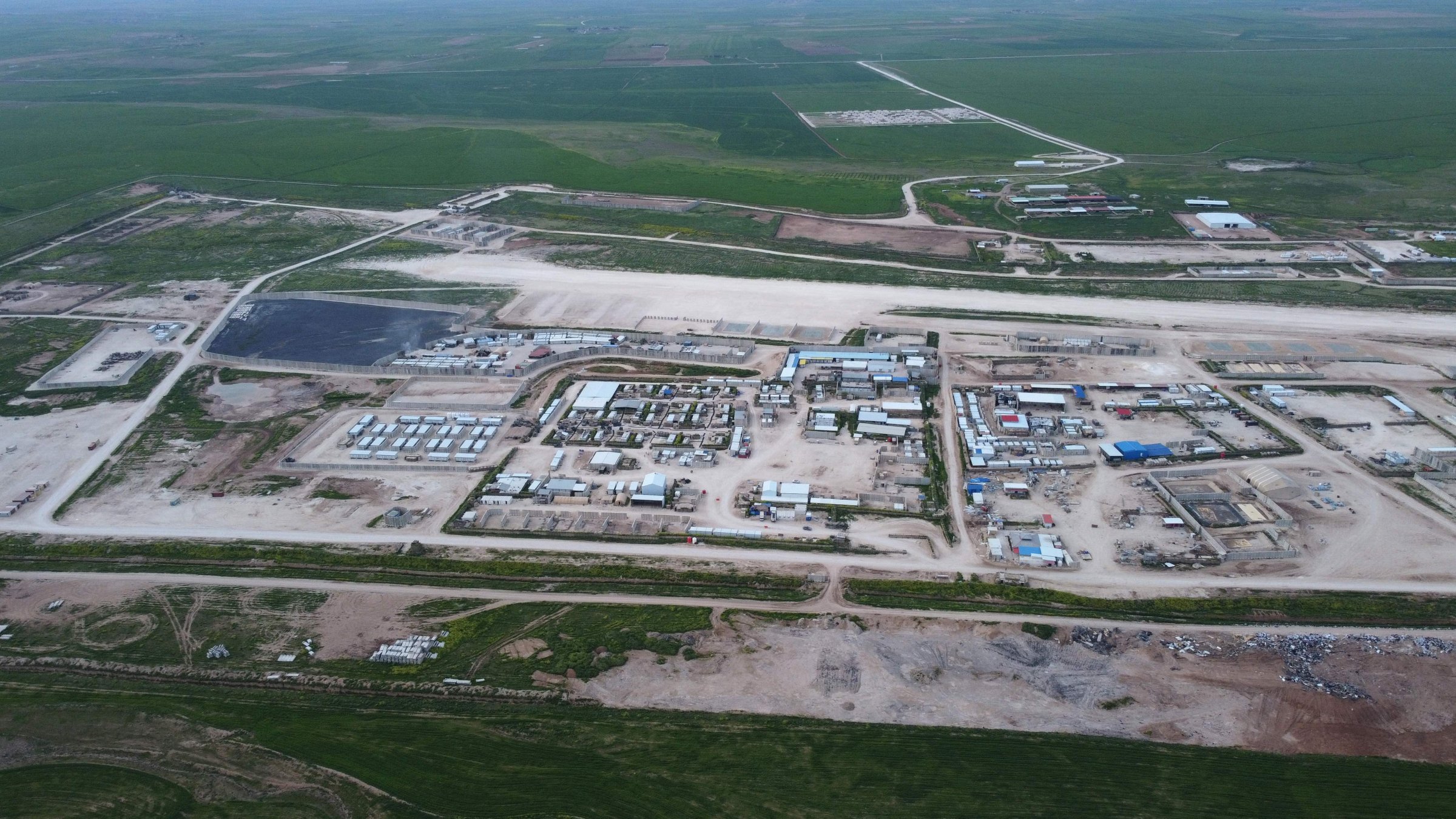 An aerial photograph shows the Qasrak Base after the withdrawal of US forces and its handover to Syrian government forces, in the countryside of the northeastern Hassakeh governorate, April 16, 2026. (AFP Photo)