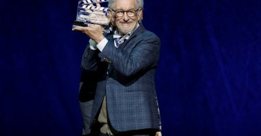 Steven Spielberg holds up his MPA America250 Award during the Universal Pictures and Focus Features presentation at CinemaCon, Las Vegas, Nevada, U.S., April 15, 2026. (Reuters Photo)