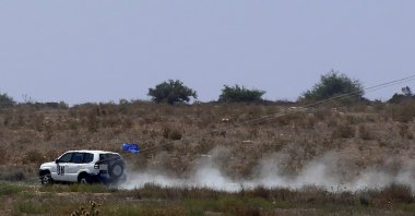 A United Nations vehicle passes inside the U.N. buffer zone at the village of Pyla in the Larnaca district of the divided island of Cyprus, Aug. 21, 2023. (AP Photo)