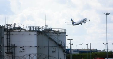 Kerosene storage facilities are seen as a Ryanair aircraft takes off from Brussels South Charleroi Airport, Charleroi, Belgium, April 16, 2026. (EPA Photo)