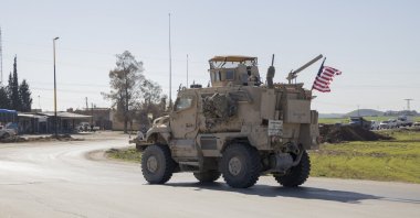 A U.S. military mine-resistant ambush protected (MRAP) armored fighting vehicle drives along a highway outside Qamishli in Syria's northeastern Hassakeh province, Feb. 22, 2026. (AFP File Photo)
