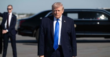 U.S. President Donald Trump walks to speak to reporters before boarding Air Force One at Palm Beach International Airport in West Palm Beach, Florida, March 23, 2026. (AFP File Photo)