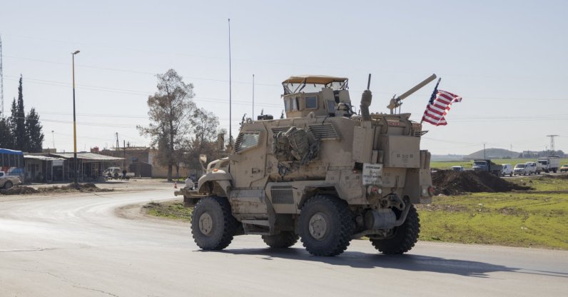 A U.S. military mine-resistant ambush protected (MRAP) armored fighting vehicle drives along a highway outside Qamishli in Syria's northeastern Hassakeh province, Feb. 22, 2026. (AFP File Photo)