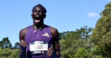 Australia's Gout Gout celebrates after winning the mens 200m final and setting a new national record, Sydney, Australia, April 12, 2026. (Reuters Photo)