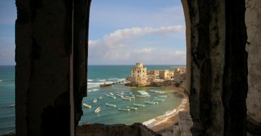 A photograph released by the African Union-United Nations Information Support Team shows a view of the Mogadishu fishing harbor from the Aruba Hotel, Mogadishu, Somalia, Aug. 6, 2012. (Photo courtesy of Sagal-Louise Haider)