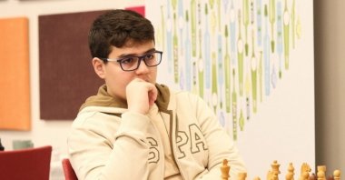In this undated file photo, Yağız Kaan Erdoğmuş competes in a chess match. (AA Photo)