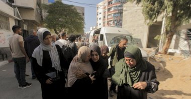 Women walk in mourning during the funeral of the Al-Khodari family in Gaza, Gaza Strip, Nov. 23, 2025. (AFP File Photo)