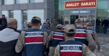 Gendarmerie officers escort detained suspects to the courthouse in Tunceli, April 16, 2026. (DHA Photo)