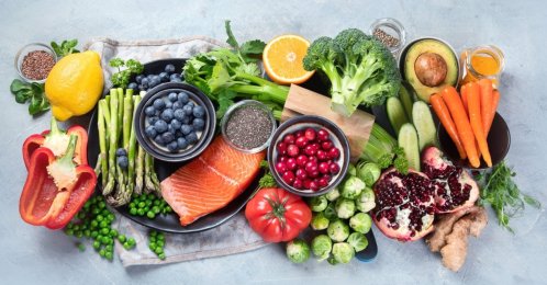 Healthy food selection on gray background, foods high in vitamins, minerals and antioxidants. (Shutterstock Photo)