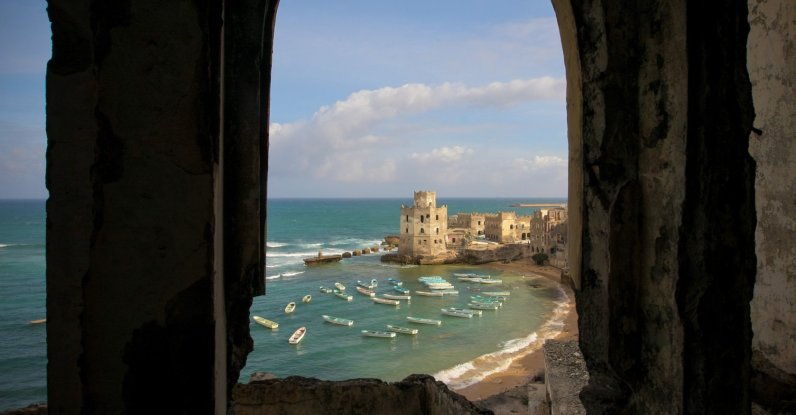 A photograph released by the African Union-United Nations Information Support Team shows a view of the Mogadishu fishing harbor from the Aruba Hotel, Mogadishu, Somalia, Aug. 6, 2012. (Photo courtesy of Sagal-Louise Haider)