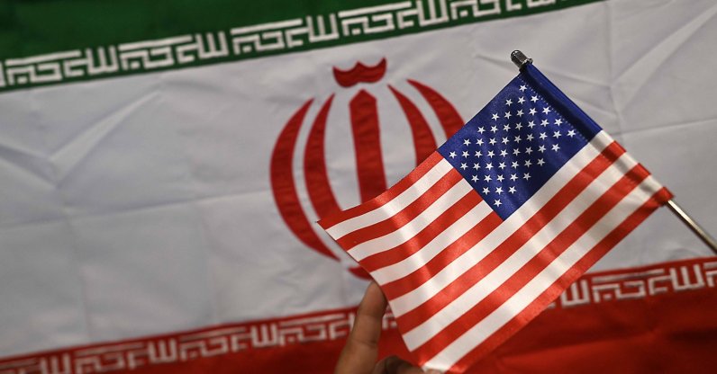 A shopkeeper displays Iranian and U.S. flags at a shop in Karachi, Pakistan, April 17, 2026. (EPA Photo)