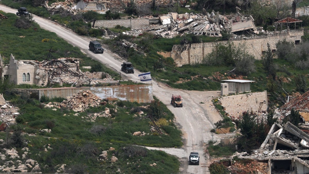Israeli military vehicles maneuver on the Lebanese side of the border as seen from the Upper Galilee, on the Israel-Lebanon border, April 17, 2026. (EPA Photo)