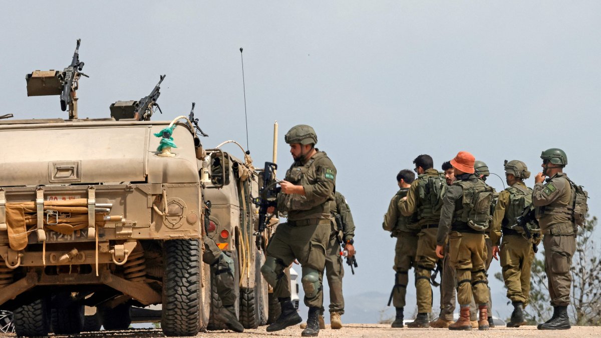 Israeli army soldiers stand next to their humvees as they patrol along the border with southern Lebanon, in the Upper Galilee of northern Israel, April 17, 2026. (AFP Photo)