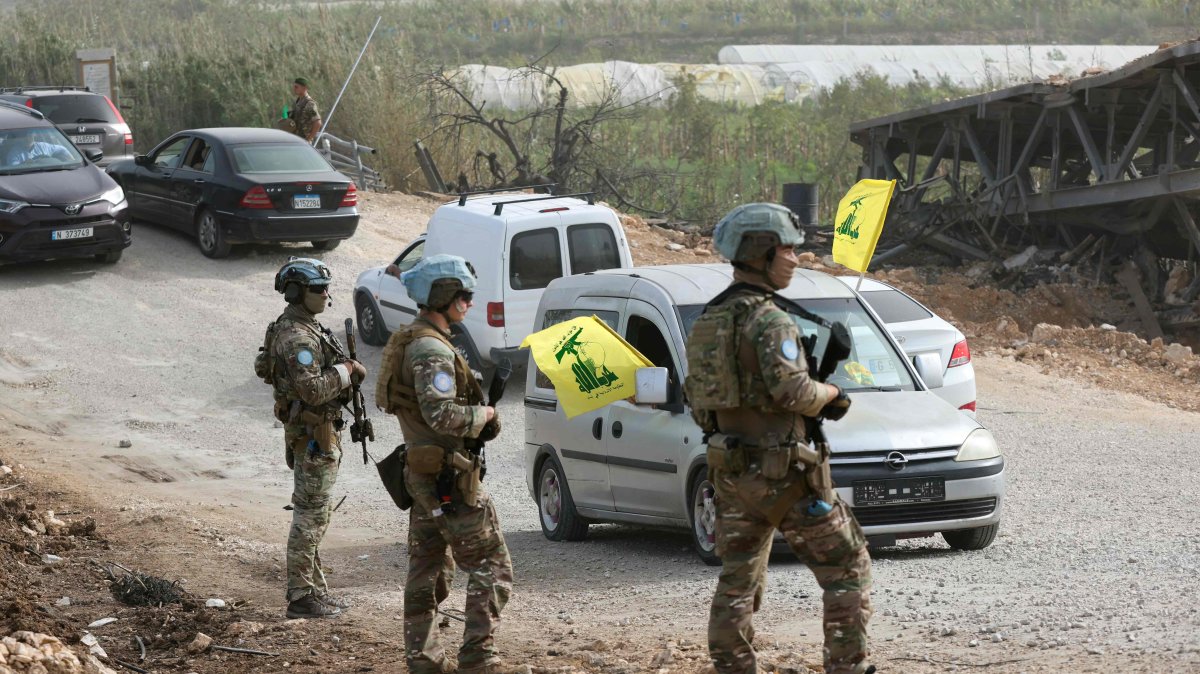 A French contingent of the United Nations Interim Force in Lebanon (UNIFIL) patrols the area as displaced residents waving Hezbollah flags make their way back to their homes on a makeshift road, built at the site where the Qasmieh bridge was destroyed in Israeli strikes, in the southern area of Al-Qasmiyeh, Lebanon, April 18, 2026. (AFP Photo)