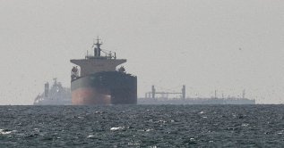 Cargo ships in the Gulf, near the Strait of Hormuz, as seen from northern Ras al-Khaimah, near the border with Oman’s Musandam governance, amid the U.S.-Israeli conflict with Iran, in United Arab Emirates, March 11, 2026. (Reuters Photo)