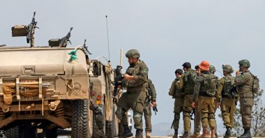 Israeli army soldiers stand next to their humvees as they patrol along the border with southern Lebanon, in the Upper Galilee of northern Israel, April 17, 2026. (AFP Photo)