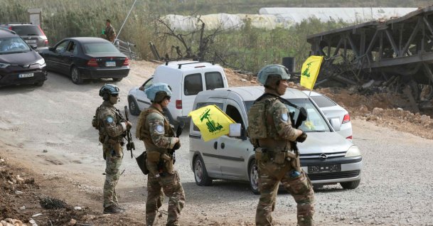A French contingent of the United Nations Interim Force in Lebanon (UNIFIL) patrols the area as displaced residents waving Hezbollah flags make their way back to their homes on a makeshift road, built at the site where the Qasmieh bridge was destroyed in Israeli strikes, in the southern area of Al-Qasmiyeh, Lebanon, April 18, 2026. (AFP Photo)