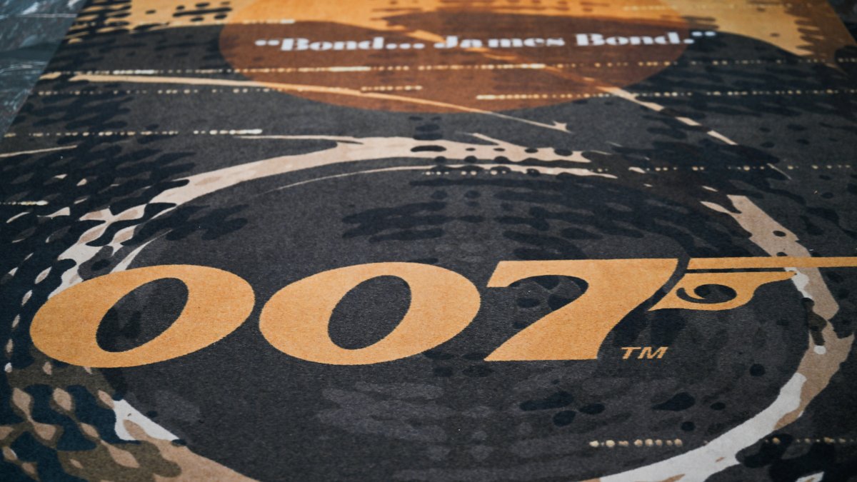 The Aston Martin DB12 Goldfinger Edition is pictured during the 007 takeover of Burlington Arcade, London, U.K., Oct. 29, 2024. (Getty Images Photo)