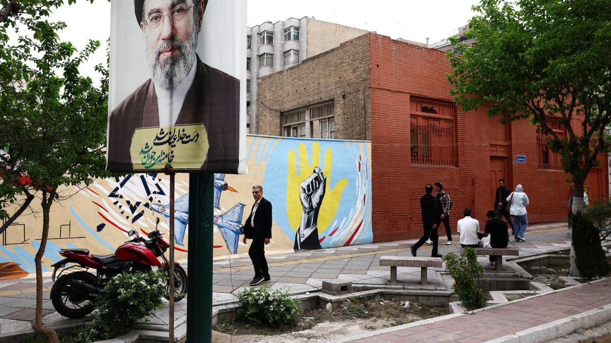 A banner with a picture of Iran's new Supreme Leader, Mojtaba Khamenei, is displayed on a street, amid a cease-fire between the U.S. and Iran, in Tehran, Iran, April 20, 2026. (Reuters Photo)