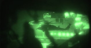 This screen grab shows U.S. Marines boarding and seizing the Iranian-flagged vessel M/V Touska in the Arabian Sea, April 19, 2026. (AFP Photo)