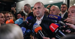 Rumen Radev (C), leader of the Progressive Bulgaria (PB) coalition, speaks to the media in Sofia, Bulgaria, April 19, 2026. (EPA Photo)