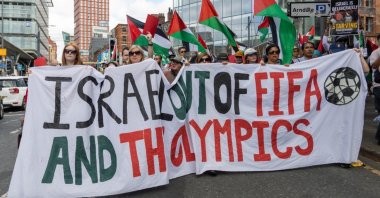 Protesters holding a banner calling for the removal of Israel from FIFA and the Olympics, Manchester, U.K., Aug. 16, 2025. (Shutterstock Photo)