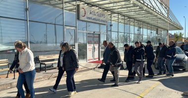 Eşme Mayor and other suspects are escorted to the courthouse after being detained in an investigation into alleged misconduct in office linked to Eşme Municipality, Uşak, Türkiye, April 20, 2026. (AA Photo)