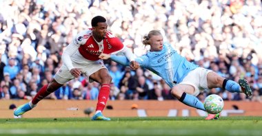 Manchester City's Erling Haaland scores his side's second goal during the a Premier League match against Arsenal, in Manchester, U.K., April 19, 2026. (AP Photo)