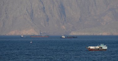 Ships and tankers are seen in the Strait of Hormuz off the coast of Musandam, Oman, April 18, 2026. (Reuters Photo)