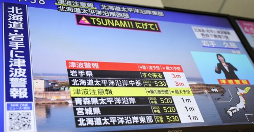 A television screen shows a news report on Japan Meteorological Agency's tsunami warning, in Tokyo, Japan, April 20, 2026. (Reuters Photo)
