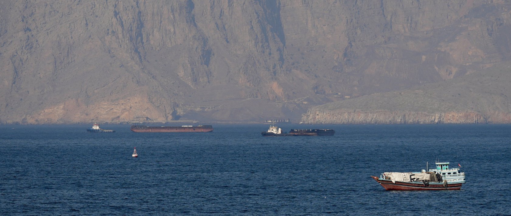 Ships and tankers are seen in the Strait of Hormuz off the coast of Musandam, Oman, April 18, 2026. (Reuters Photo)