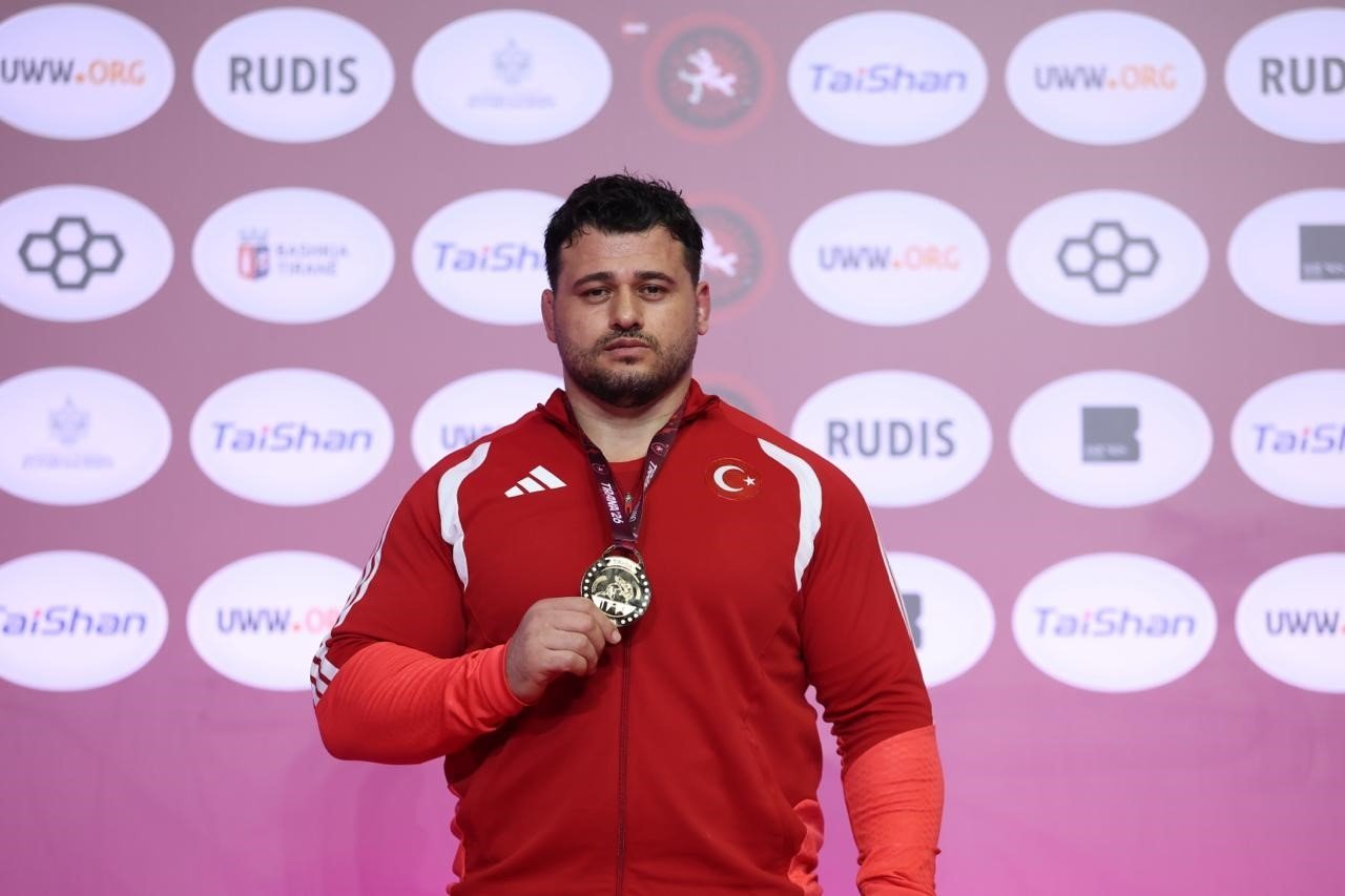 Rıza Kayaalp gestures after winning gold at the 2026 European Wrestling Championships in Tirana, Albania, April 22, 2026. (IHA Photo)
