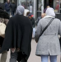 Women with headscarves are walking in a pedestrian zone in Vienna, Austria, April 21, 2017. (AP File Photo)