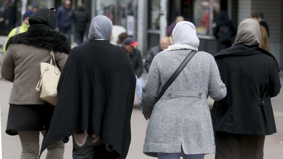 Women with headscarves are walking in a pedestrian zone in Vienna, Austria, April 21, 2017. (AP File Photo)