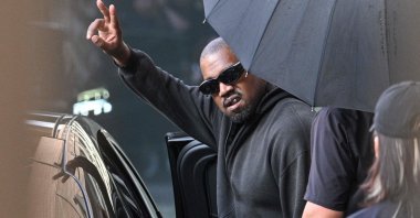 U.S. rapper and producer Kanye West gestures upon arriving at Shanghai Pudong International Airport, Shanghai, China, July 11, 2025. (AFP Photo)
