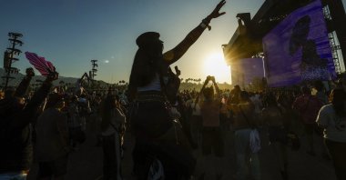 Festival goers dance as U.S. electronic artist Major Lazer performs during day three of weekend two at the 2026 Coachella Valley Music and Arts Festival, California, U.S., April 19, 2026. (EPA Photo)