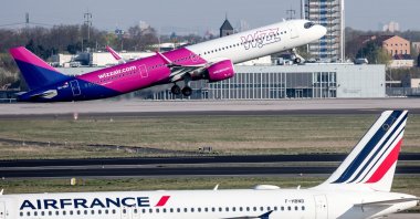A Wizz Air and Air France aircraft are photographed at Berlin Brandenburg Airport, Schoenefeld, Germany, April 17, 2026. (EPA Photo)