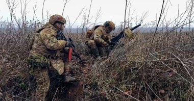 Russian soldiers prepare to fire a grenade launcher toward Ukrainian positions on an undisclosed location in Ukraine, March 31, 2026. (AP Photo)