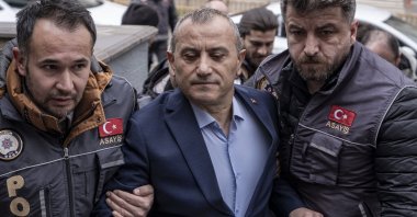 Police officers escort former Governor Tuncay Sonel (C), a suspect in the disappearance of Gülistan Doku, Erzurum, eastern Türkiye, April 21, 2026. (AA Photo)