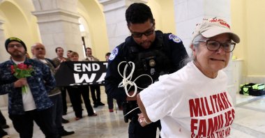 A protester's hands are zip-tied during a protest against the Iran war by veterans from the group About Face and members of military families in the Cannon House Office Building Rotunda on Capitol Hill in Washington, D.C., U.S., April 20, 2026. (Reuters Photo)
