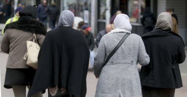 Women with headscarves are walking in a pedestrian zone in Vienna, Austria, April 21, 2017. (AP File Photo)