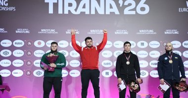 Rıza Kayaalp gestures after winning gold at the 2026 European Wrestling Championships in Tirana, Albania, April 22, 2026. (AA Photo)