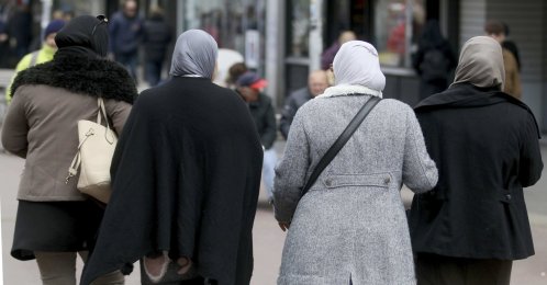 Women with headscarves are walking in a pedestrian zone in Vienna, Austria, April 21, 2017. (AP File Photo)