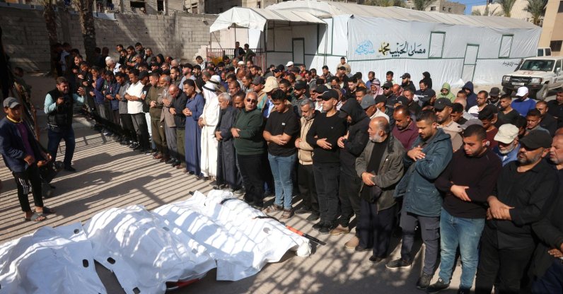Palestinian pray over the bodies of people killed in an Israeli airstrike, prior to their burial in the city of Khan Yunis, in the southern Gaza Strip, April 21, 2026. (AFP Photo)