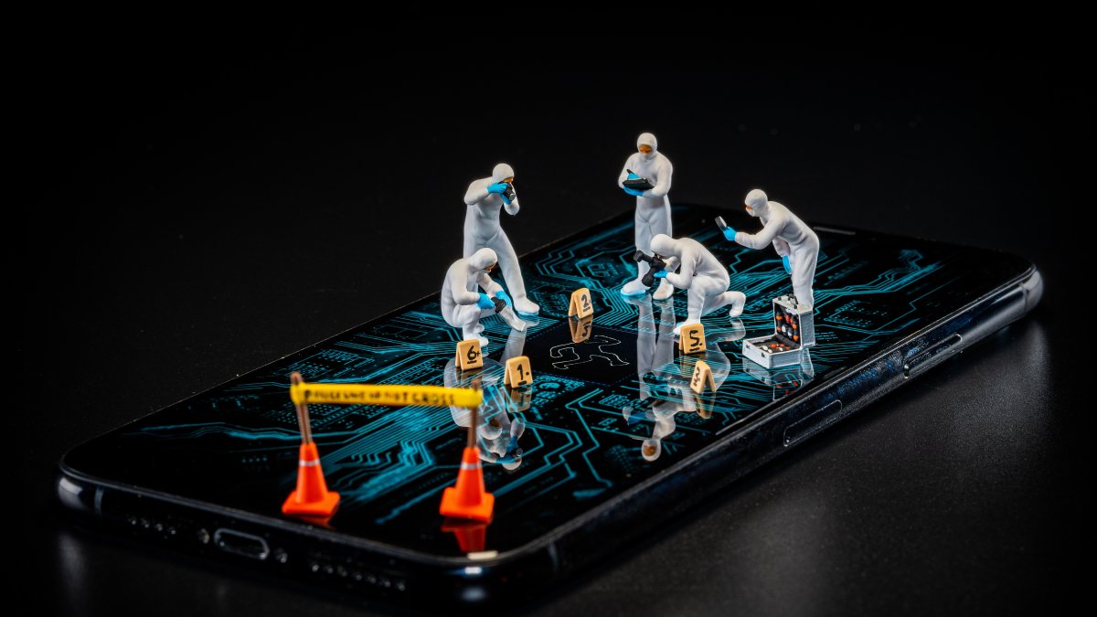 Miniature forensic experts search for the microscopic fingerprints of "digital contamination." As algorithms dismantle the gatekeepers of truth, journalism’s new duty is to draw the yellow tape around the algorithmic betrayal of our social reality. (Getty Images Photo)