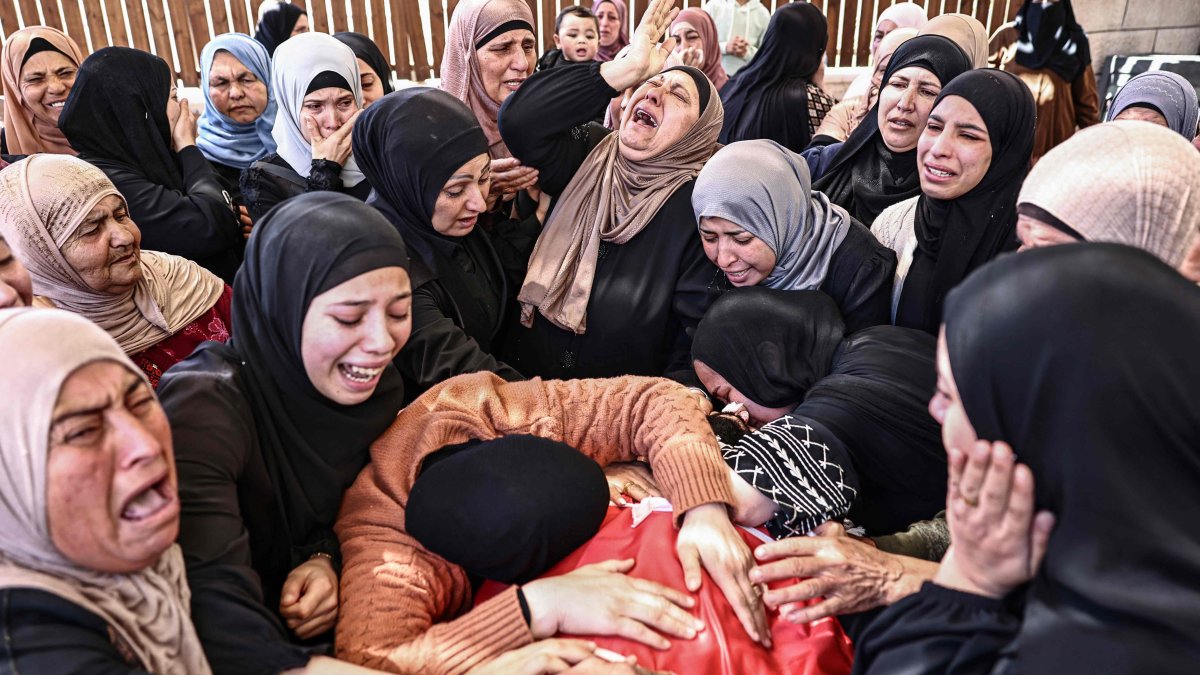 Relatives mourn the death of Jihad Marzouq Abu Naim during his funeral in Al-Mughayyir, east of Ramallah, in the Israeli-occupied West Bank, April 22, 2026. (AFP Photo)